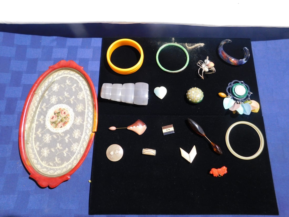 Bakelite etc. Jewelry: Bakelite etc. Jewelry, includes: bakelite tray (broken), orange Bakelite blown glass and other bracelets, pins. CONDITION: One missing pin back, etc.