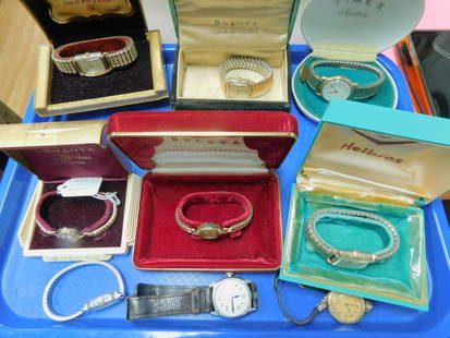 9 Vintage Wrist Watches: 9 Vintage Wrist Watches in original boxes includes: Bulova (2 lady's & 1 Man's) Helbros (Man's), Wittnauer (Man's) Timex Electric (Man's); plus 3 with no boxes; Geneva (lady's), Waltham (Man's), and E