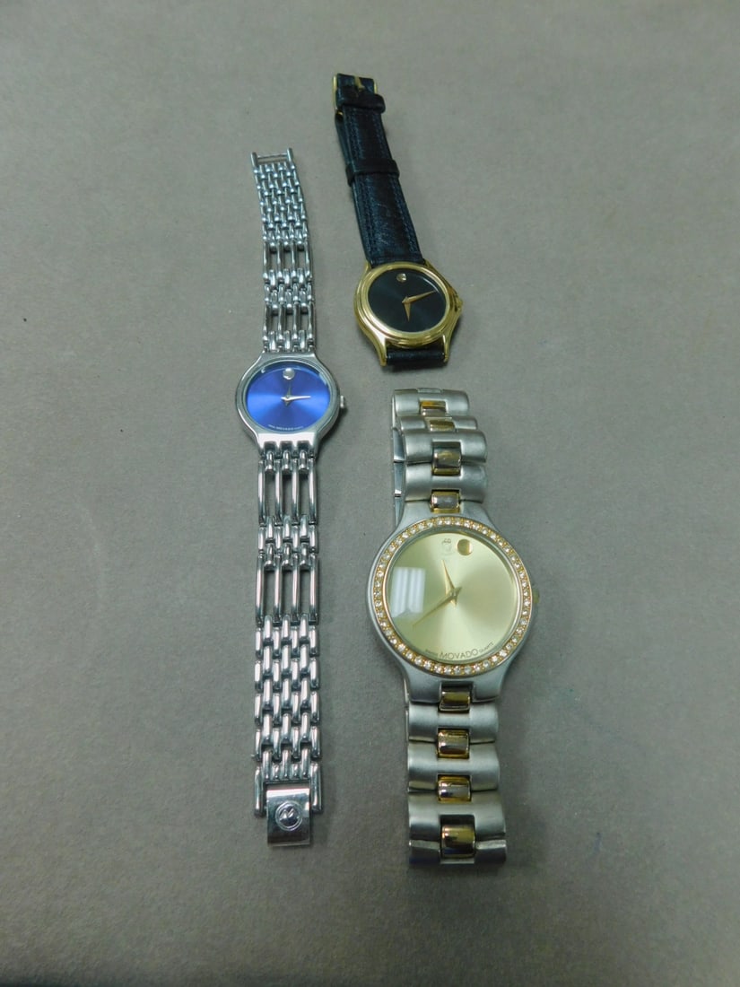 3 Movado Wrist Watches: 3 Movado Wrist Watches, all quartz includes blue, black and gold dials, authentification not guaranteed. CONDITION: Used, needs batteries; gold dial as loose gold dot.