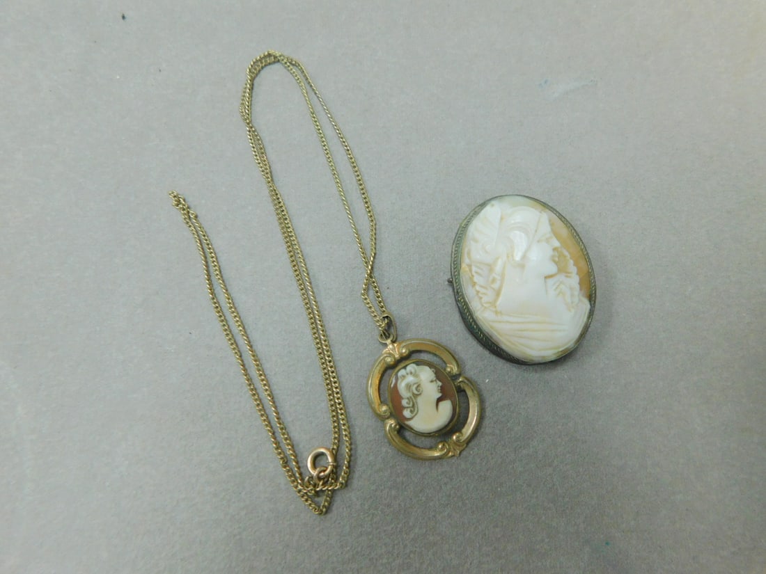 Cameo Jewelry: Cameo Jewelry includes: a sterling framed shell carved female portrait brooch (1" x 1 1/4"), and a gold filled framed female portrait cameo on a 20't chain. CONDITION: Vintage used, tarnished, bent cl