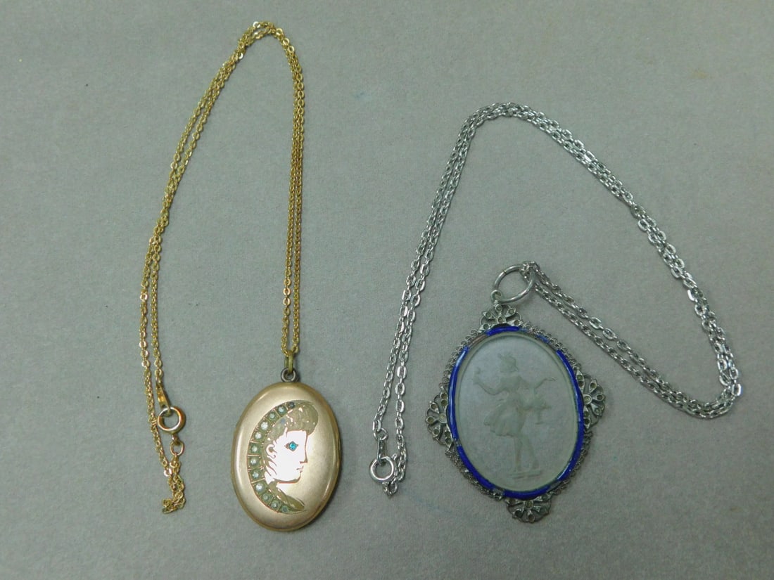 Locket & Deco Necklace: Locket & Deco Necklace includes: silvered wire work frame with blue enamel border around an etched glass female standing figure (2" x 1 1/2") on a 20" chain, and a gold filled locket with etched femal