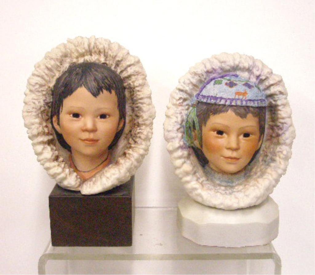 Cybis Eskimo Boy & Child Busts: Cybis porcelain 7 1/4" x 6" Eskimo Boy, Snow Bunting & 8" x 6" Eskimo Child bust figurines mounted on wood bases, overall sizes are 10 1/4" x 6" & 9 1/4" x 6". CONDITION: Both are very good with no da