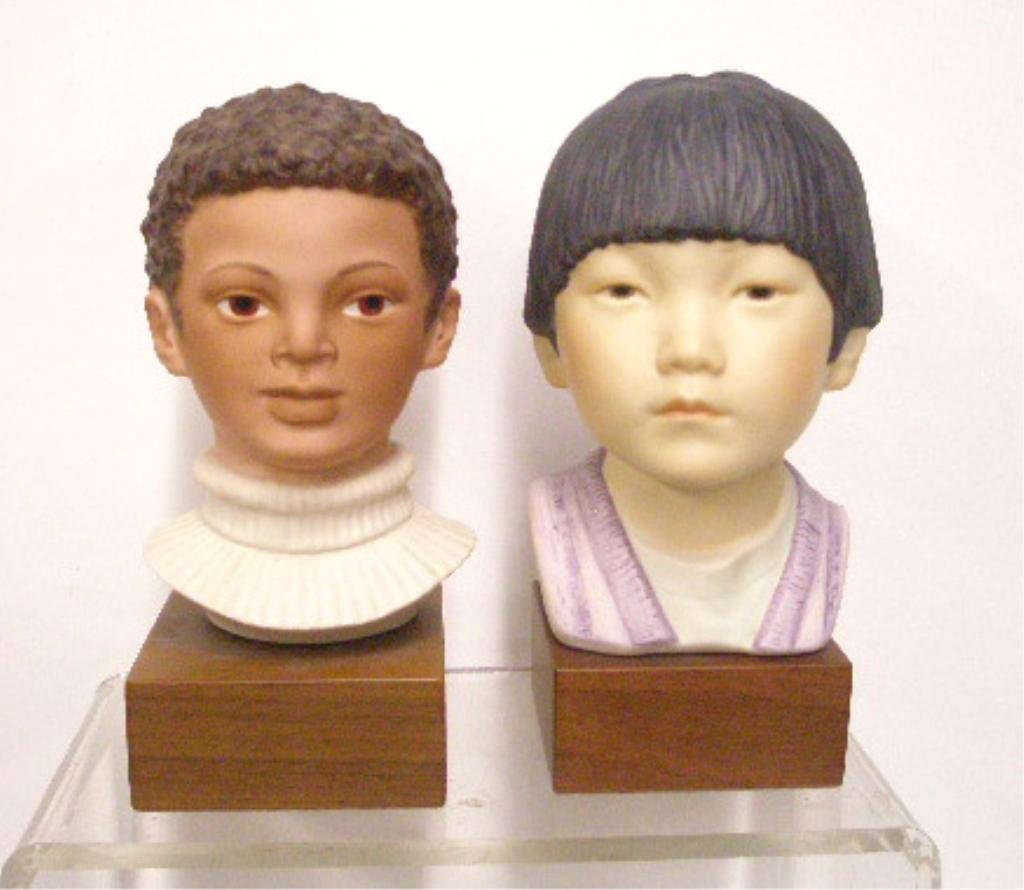 Cybis Jason & Asian Boy Busts: Cybis porcelain 7" x 4 1/2" #A04002 Jason & 7 1/2" x 4 1/2" Asian Boy bust figurines mounted on wood bases, overall sizes are 9" x 4 1/2" & 9 1/2" x 4 1/2". CONDITION: Both are very good with no damag
