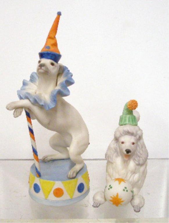 Cybis Circus Dog Figurines: Lot of two Cybis porcelain Circus Dog figurines, 8 1/4" #692 Dandy The Dancing Dog & 4 1/2" x 5" Circus Poodle with Ball. CONDITION: Both are very good with no damage.