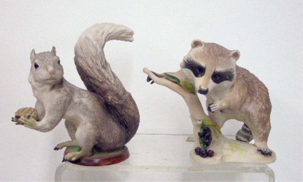 Cybis Mr. Fluffy Tail & Raffles Figurines: Cybis porcelain 7 1/4" x 7" Squirrel, Mr. Fluffy Tail & 7" x 8" Rafffles The Raccoon Figurines CONDITION: Squirrel is very good with no damage, Raffles has broken leaf & stem.