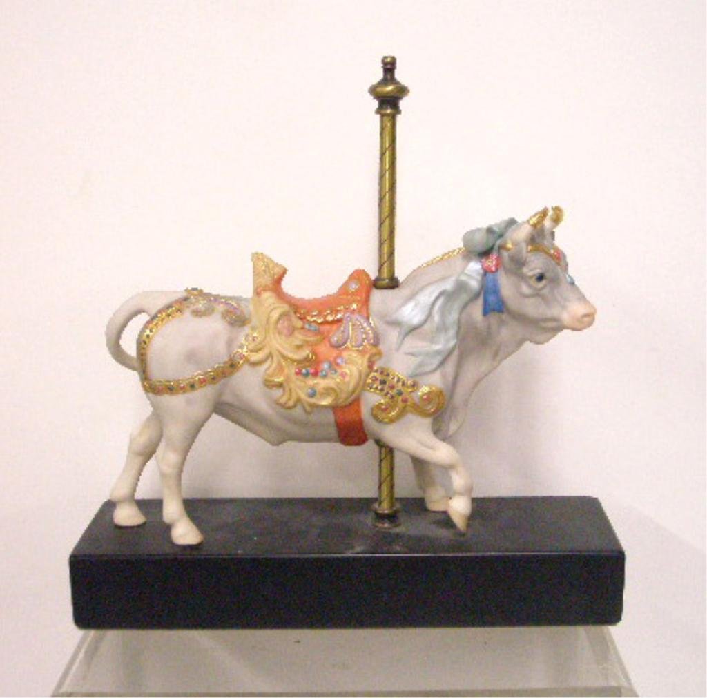 Cybis Carousel Bull Plutus Figurine: Cybis porcelain 7 1/2" x 10 1/2" Carousel Bull Plutus figurine mounted on wood base, overall size is 12" x 12". CONDITION: Very good with no damage.