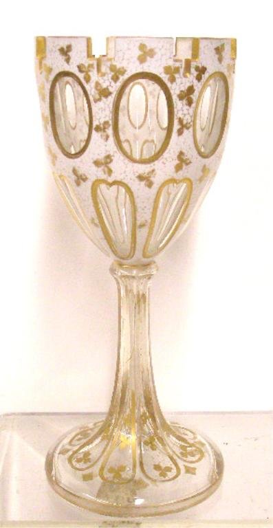 19th c. Bohemian Glass Chalice: 19th c. Bohemian cased glass 11" chalice, with gilt painted floral overlay designs. CONDITION: Very good with gilt loss.