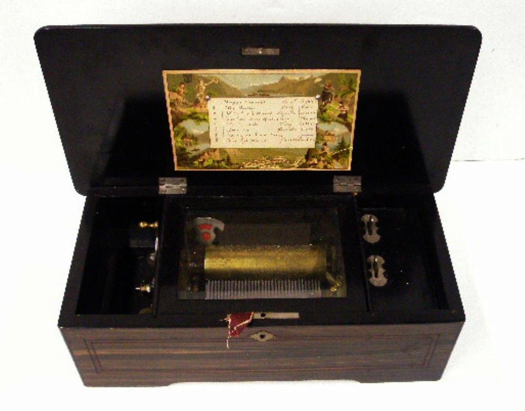 Antique Swiss Cylinder Music Box: Antique Swiss 5 1/4" x 16" x 8" eight tune playing cylinder music box. CONDITION: Works, wear & scratches on case.