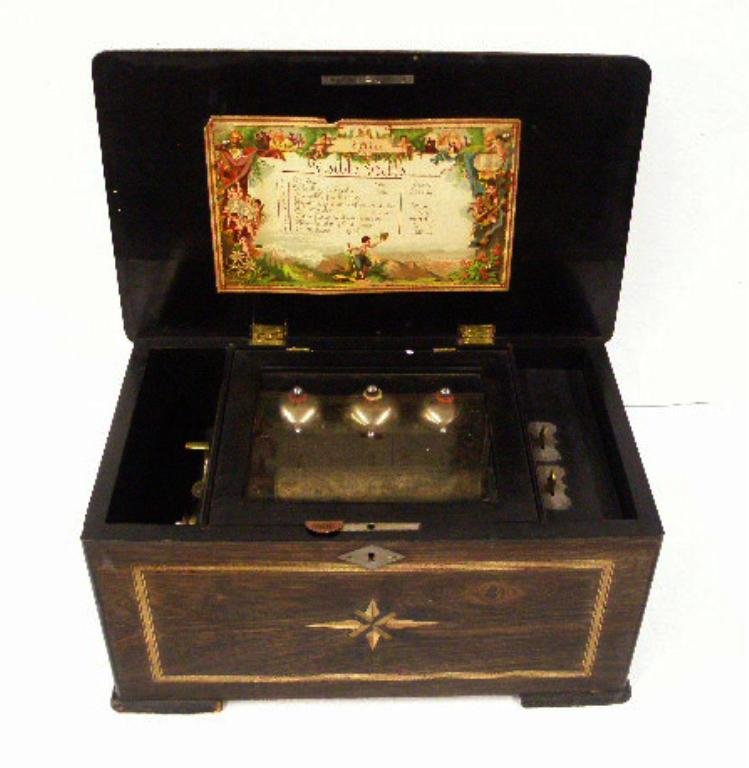 Antique Swiss Visible Bells Music: Antique Swiss 8 1/4" x 16" x 9 1/2" eight tune playing Visible Bells Music box, inlaid front & top lid panels. CONDITION: Works, cylinder is missing 1 tooth, areas with wear & or loss on case.