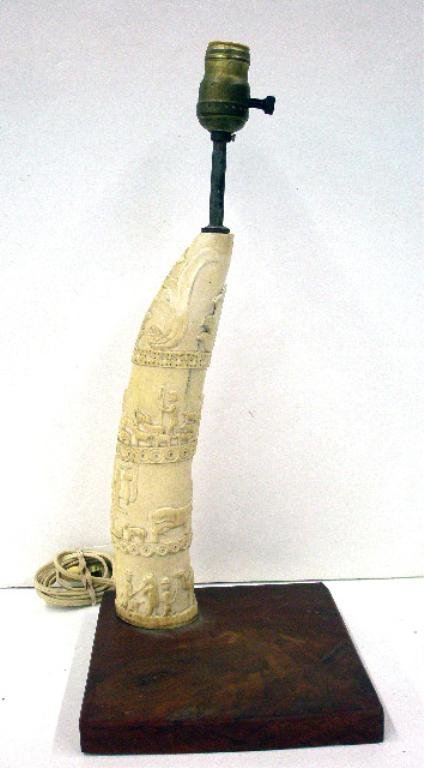 Antique African Ivory Tusk Lamp: Antique 12" carved African ivory tusk with raised scenes depicting the birth of Jesus, mounted as a lamp, overall size is 18 1/4". No International or California shipping for this item. Condition: Wor