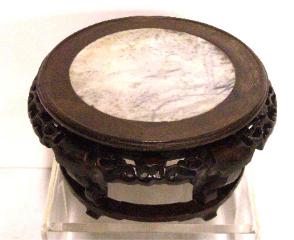 Chinese Wood & Marble Stand: Contemporary Chinese carved wood 4 1/2" x 9" table stand with a white & grey marble inset on top. CONDITION: Very good with minor wear. [12]