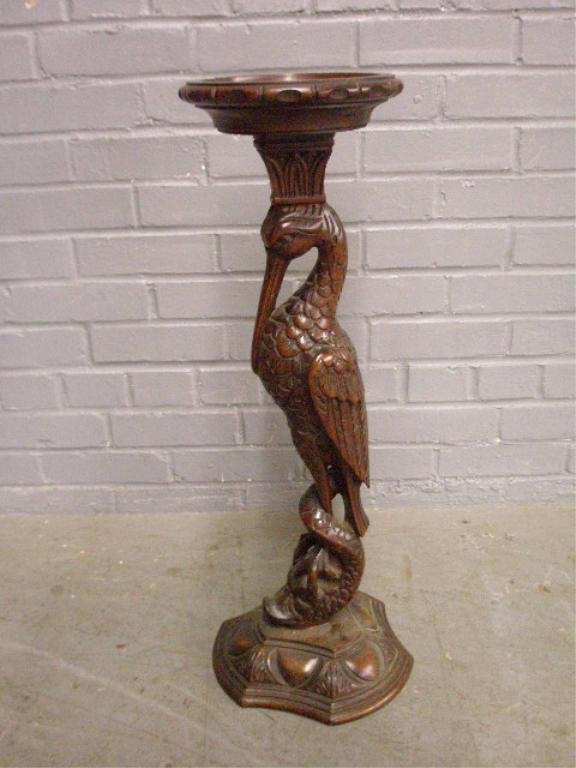 Renaissance Revival Floor Ashtray Stand: Renaissance Revival carved walnut floor ashtray stand, intertwined crane and dolphin pedestal, American, late 19th C.; 26 1/2" = height. Condition: ashtray support with single horizontal crack; ashtra