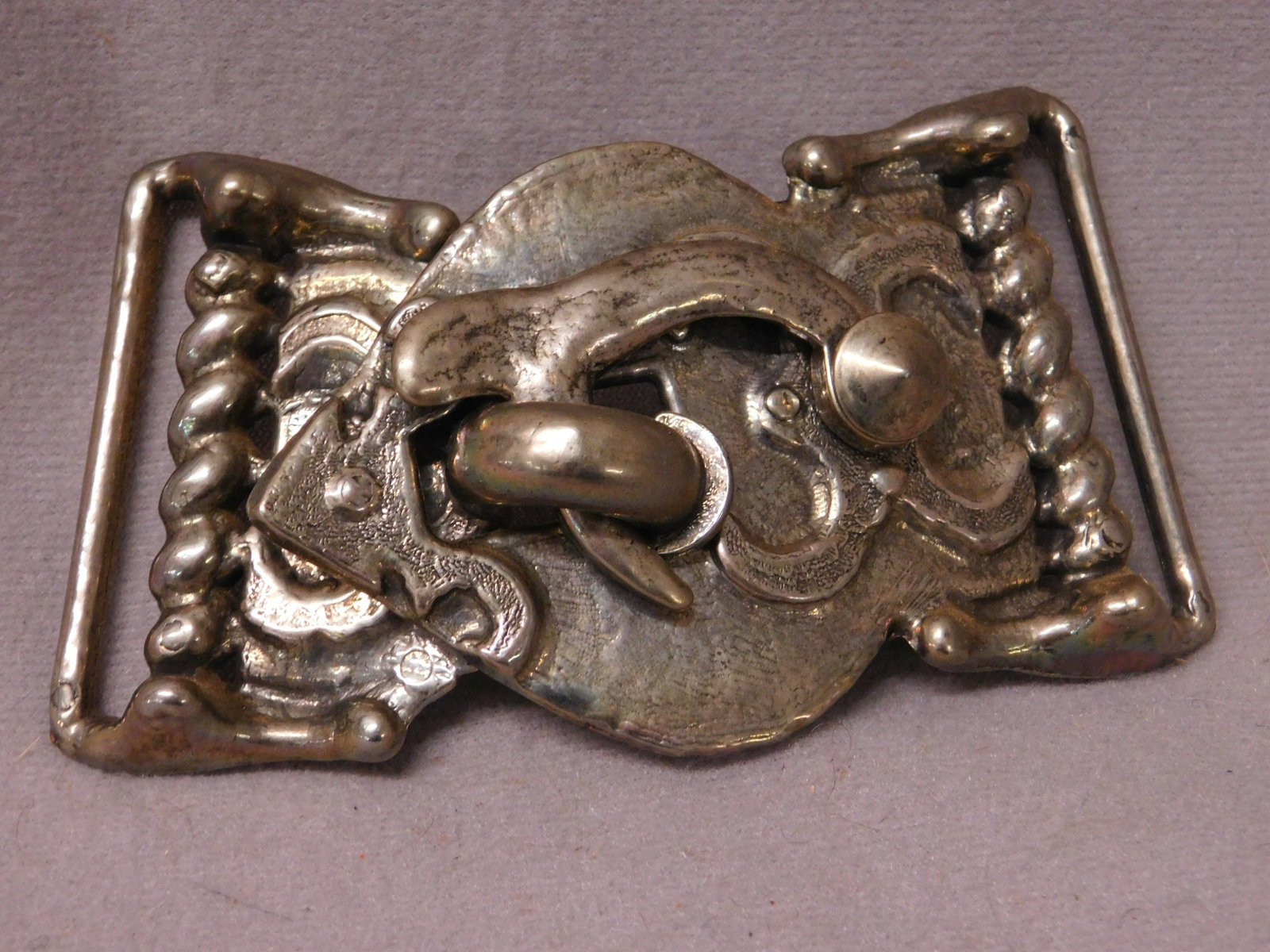 Unique 2 Pc Hook & Latch Belt Buckle: Unique two piece Hook and Latch Belt Buckle, unmarked metal belt buckle with faux spring design edges, center connecting hook and latch fixed end buckle loops, 2 3/8" x 4 1/2". CONDITION: Very good.