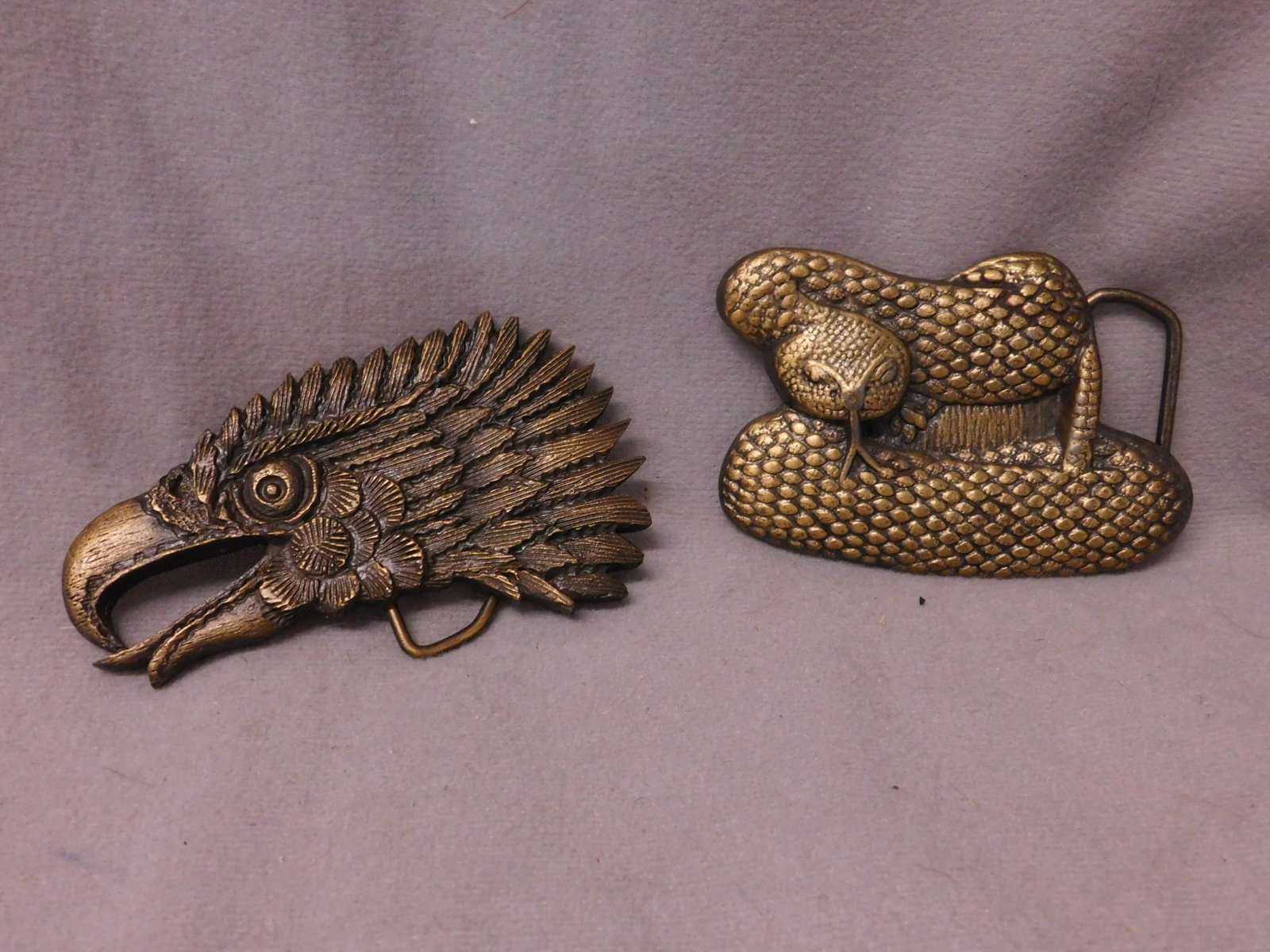 Vintage Eagle & Rattlesnake Belt Buckle: Vintage Eagle and Rattlesnake Belt Buckle, including: artist signed (J.R. Gray) Eagle head, Indiana Metal Craft (signature and foundry mark on back, 2 1/4" x 3 3/4", plus unmarked (Bergamot?) coiled r