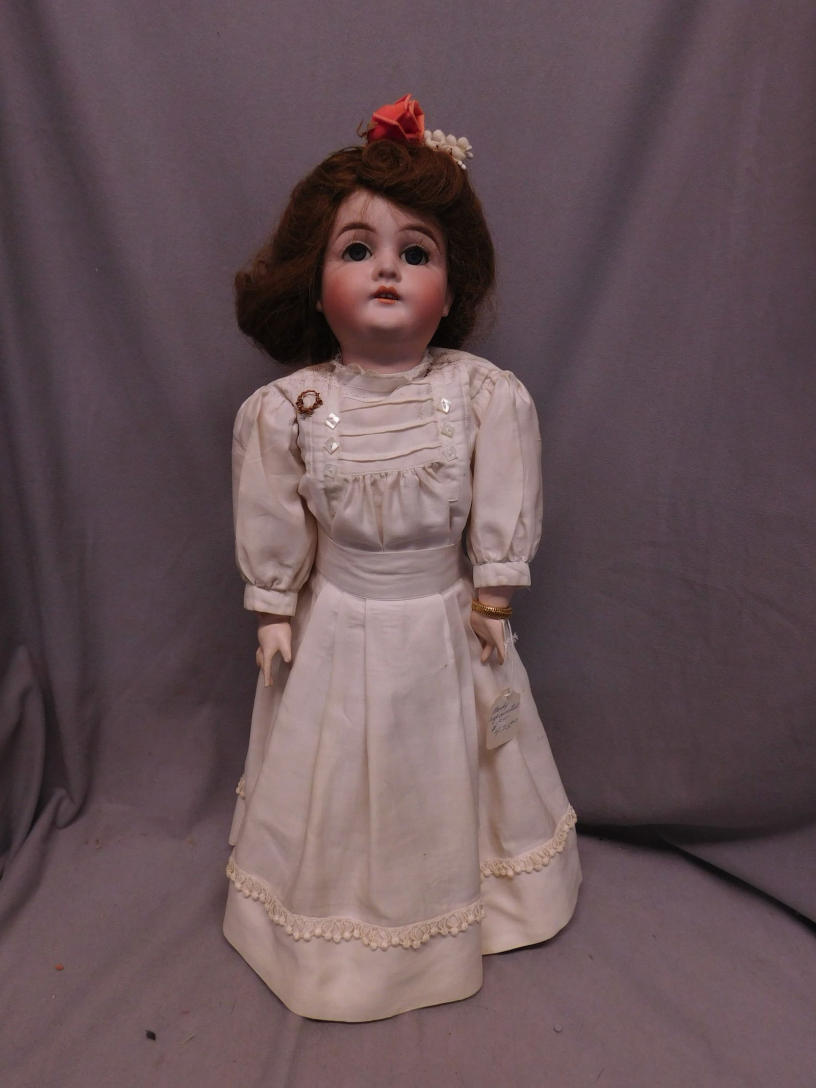 Karl Hartmann Child Doll: Karl Hartmann Child Doll, German, bisque head "28", blue sleep eyes, open mouth with teeth, brown wig, composition ball jointed body, white cotton gown, and under garments, approx. 21". [7] CONDITION: