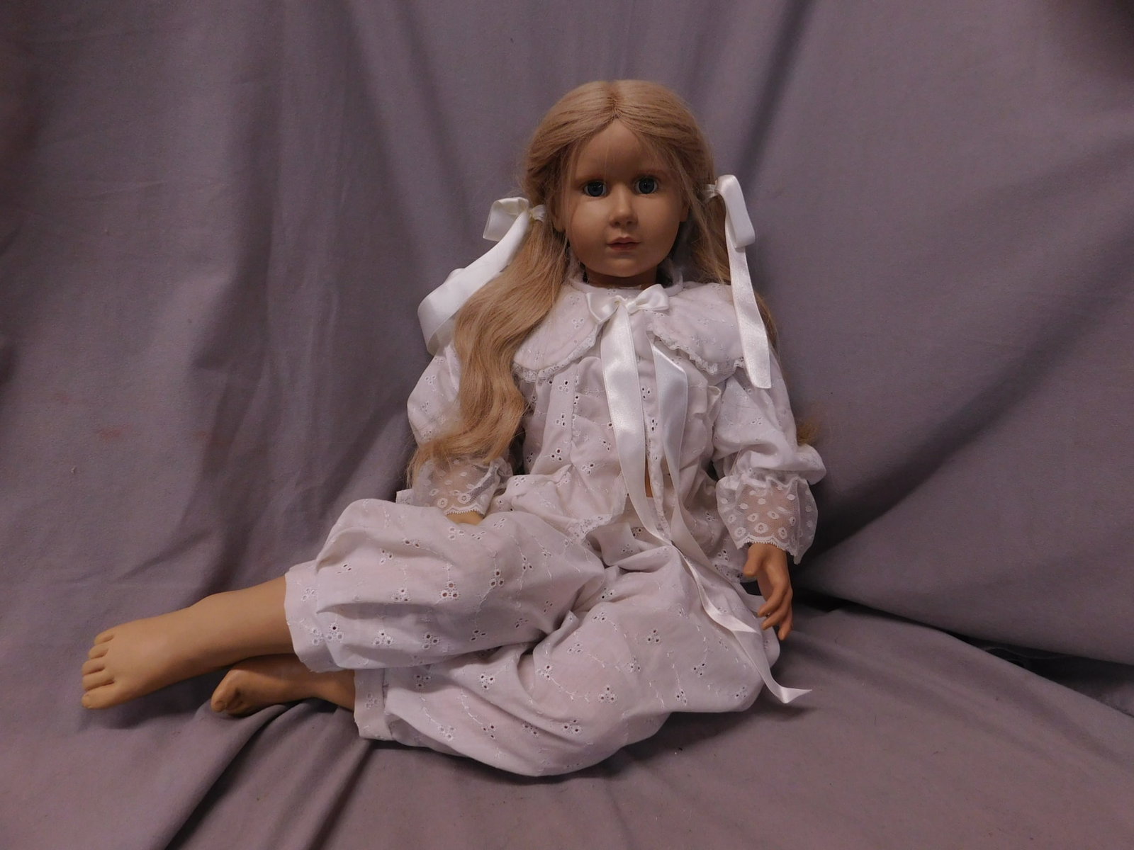 H(ildegard) Gunzel Character Doll: H(ildegard) Gunzel Character Doll, limited edition vinyl, blue paperweight eyes, long blond wig, bent limbs, white cotton floral embroidered and pierced two piece pajama set, approx. 29"h, original pa