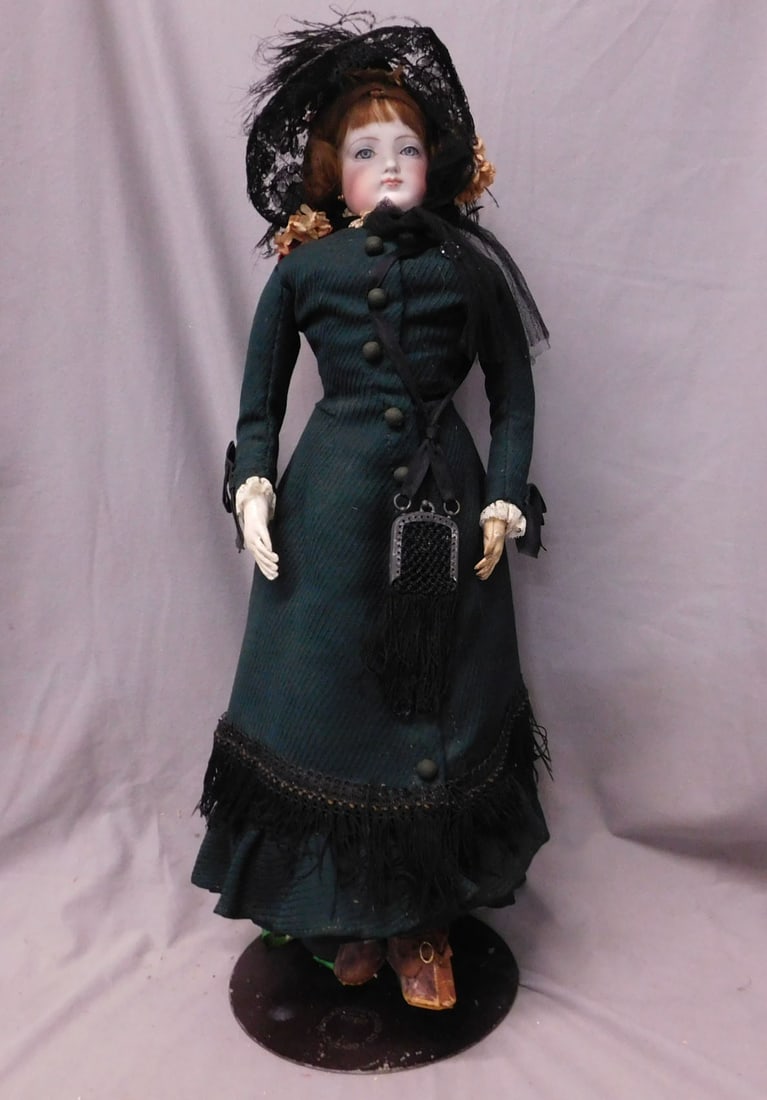 French Fashion Doll: French Fashion Doll, bisque swivel head in bisque shoulder, blue paperweight eyes, brown wig, closed mouth, pierced ears, no visible maker's markings, kid skin body, vintage custom black / green, bust