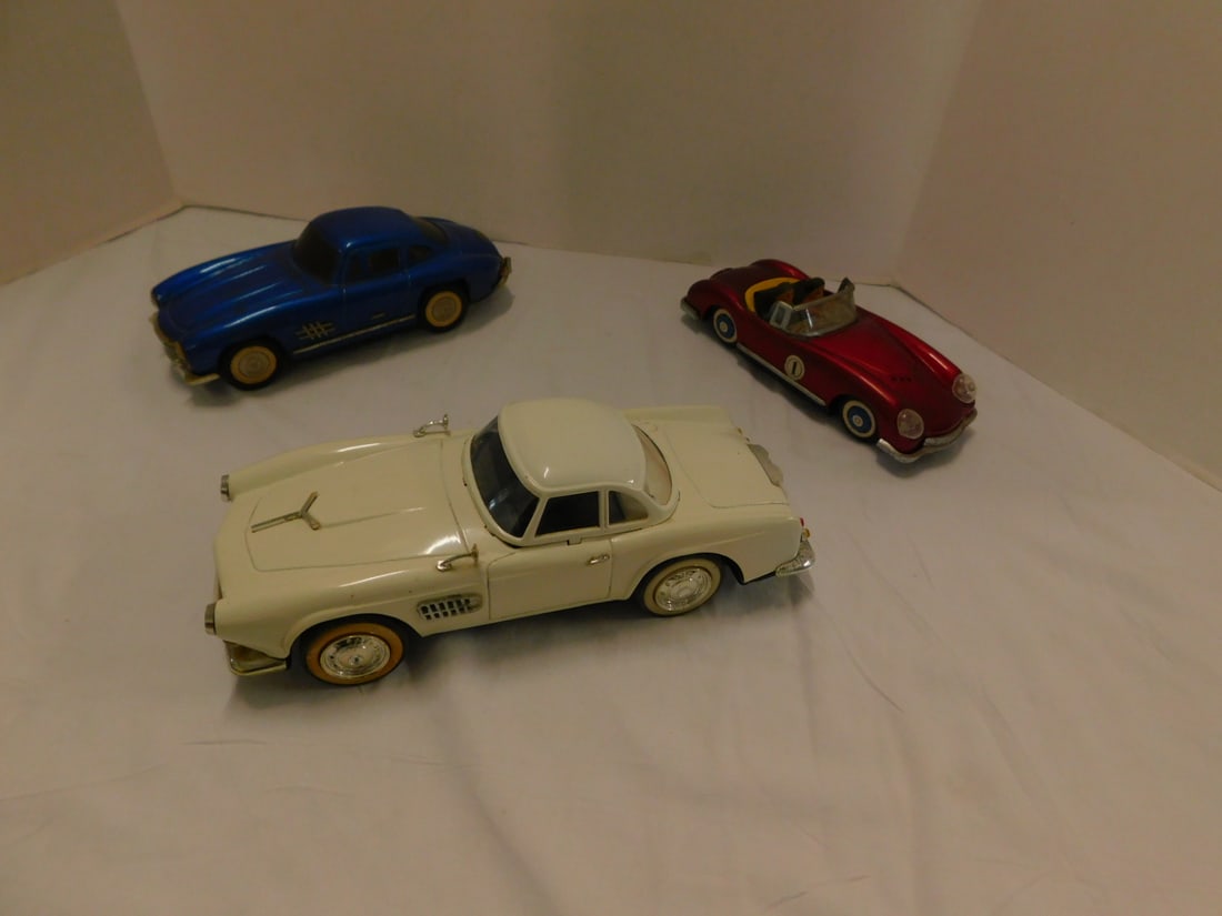 9 Vintage Tin Friction Cars: Nine Vintage Tin Friction Cars, all loose, no boxes including: White Foreign Sports car MF344, 11", Blue Mercedes, MF326?, 9 3/4" and Racing Car 1, MF 763, 8 1/2", all Made in China. CONDITION: Minor