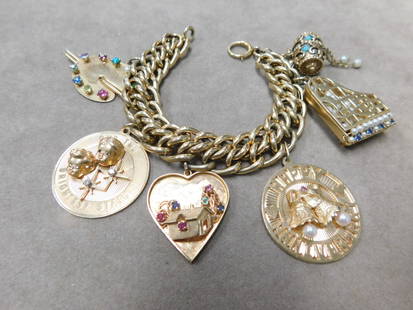 14k yg Charm Bracelet: 14k yg Charm Bracelet, 1' wide double chain link 7" bracelet with six large charms with diamonds, sapphires, pearls, etc. 50.7 DWT. CONDITION: Very fine. Preowned.