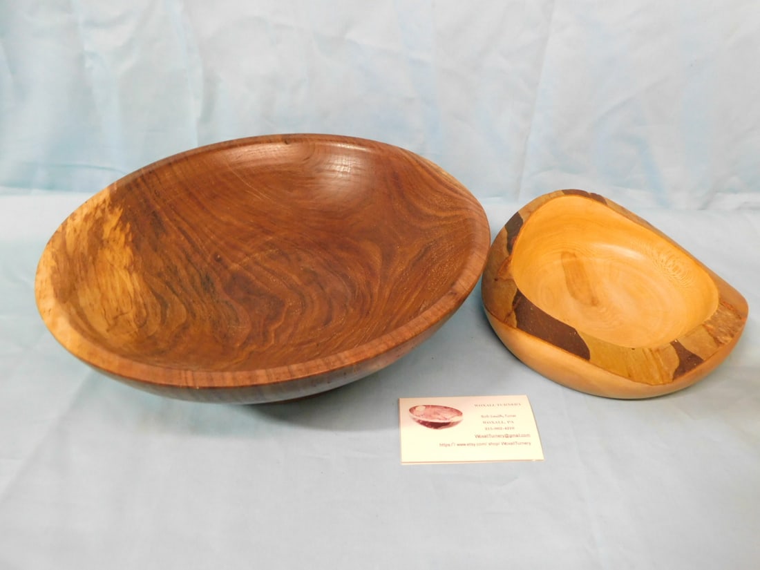 2 Bob Smith "Woxall Turnery" Bowls: 2 Bob Smith "Woxall Turnery" Bowls includes: Black Walnut bowl D 11 3/4", H 4" and a Sycamore Bowl D 7 1/2", H 2 3/4". Both signed and dated 2022, includes Business card. CONDITION: Very good, natural
