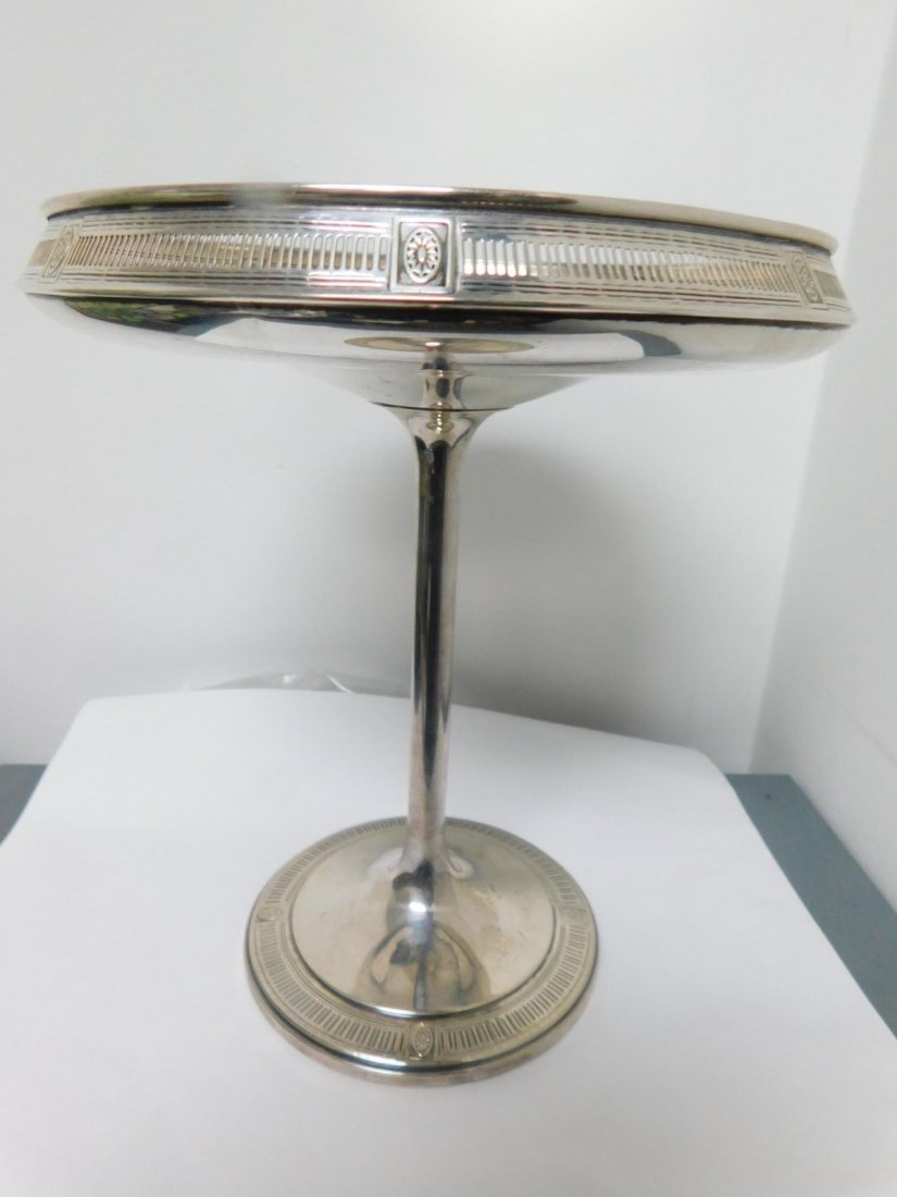 Sterling Silver Compote: Sterling Silver Compote, Neo Classical pierced rim with rosette panels and conforming base, 8"h, 7 1/2"d, 7.85 ozts. CONDITION: Very slight scratches.