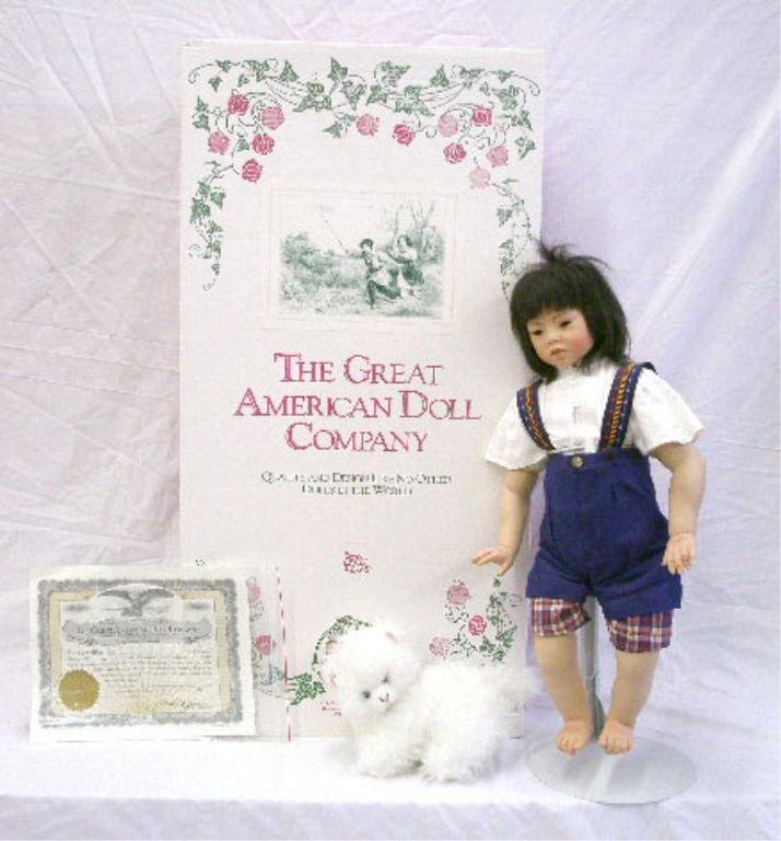 Rotraut Schrott Porcelain Poyi Doll: Rotraut Schrott designed The Great American Doll Company 23" porcelain Poyi doll with box, limited edition #436/2500. CONDITION: Very good with no damage, box has wear.