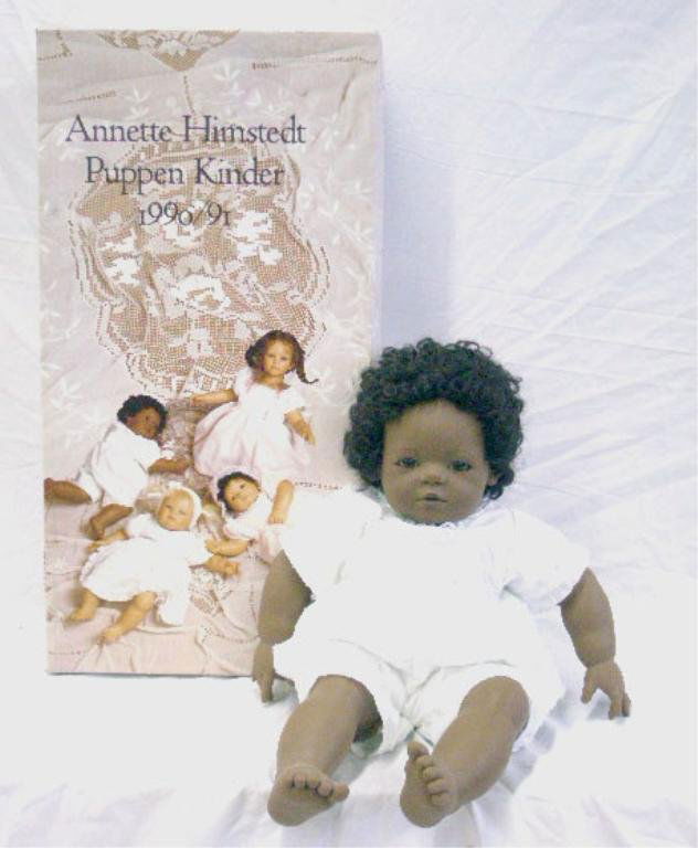 1990/91 Annette Himstedt Mo Doll: 1990/91 Annette Himstedt Barefoot Babies Collection 21" hard vinyl Mo (boy from U.S.A.) doll with box. CONDITION: Very good with no damage, box has wear.