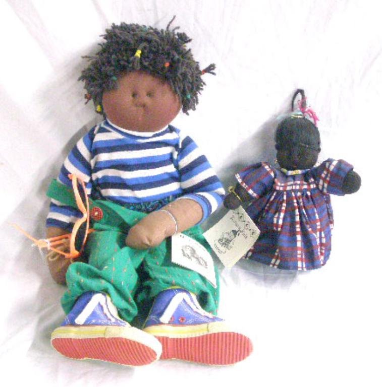 1986 & 1994 Little Souls Inc. Dolls: 1986 & 1994 Gretchen Wilson Little Souls Inc. 24" boy with sunglasses & 8" Kumasi Kids dolls. CONDITION: Sunglasses are broken on 24" doll, Kumasi kids has no damage.