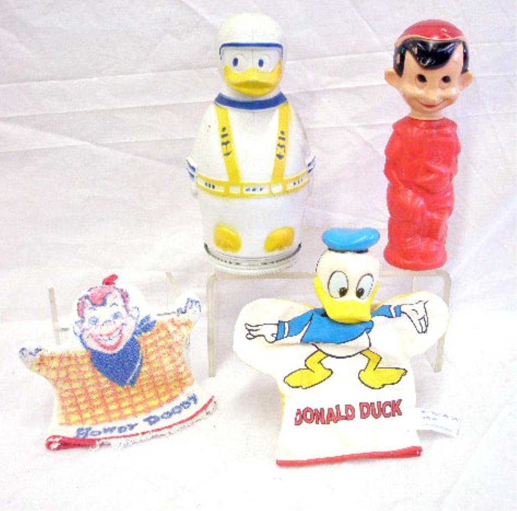 Vintage Walt Disney Novelty Toys: Lot of vintage Walt Disney novelty toys, Puppets Wheat Puffs Donald Duck bank, Donald Duck cloth & plastic hand puppet, Donald Duck sock & Pinocchio Soaky bottle, together with 1950's towel form Howdy