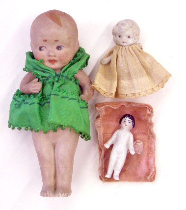 Antique Porcelain Bisque Dolls: Antique German porcelain & Japanese bisque dolls, German 2" frozen Charlotte, Japanese full bisque 2 1/4" with jointed arms & Nippon painted full bisque 5 1/2" with jointed arms. CONDITION: Nippon has
