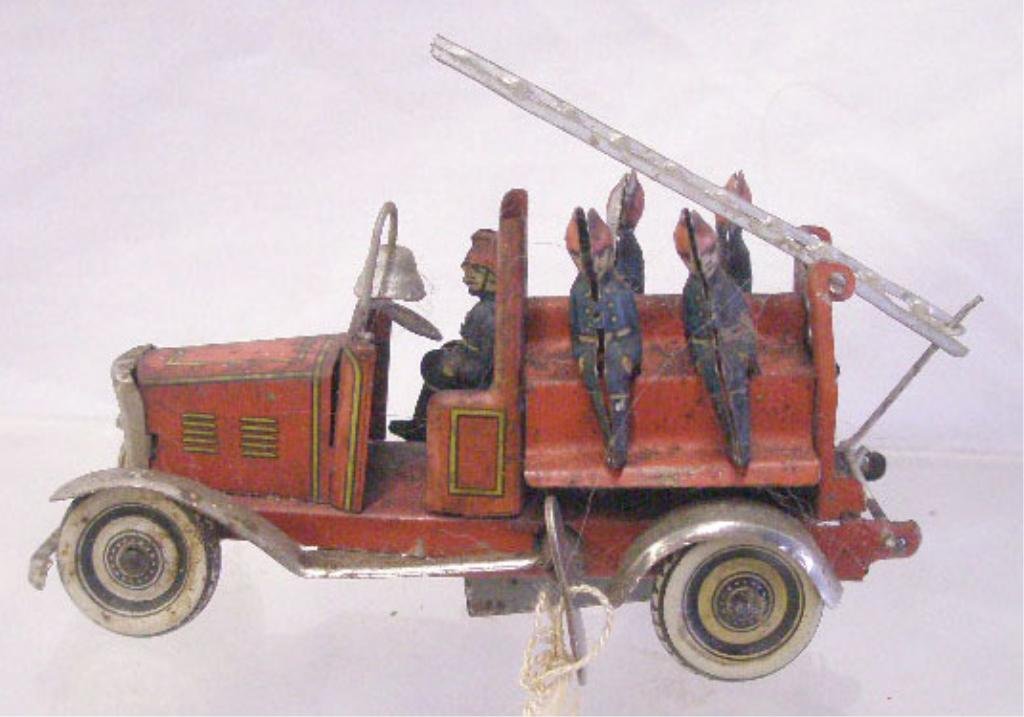 1920's German Tin Fire Truck Penny Toy: 1920's German lithographed tin clockwork wind-up 3" x 4 1/4" fire ladder truck penny toy. CONDITION: Minor wear & loss.