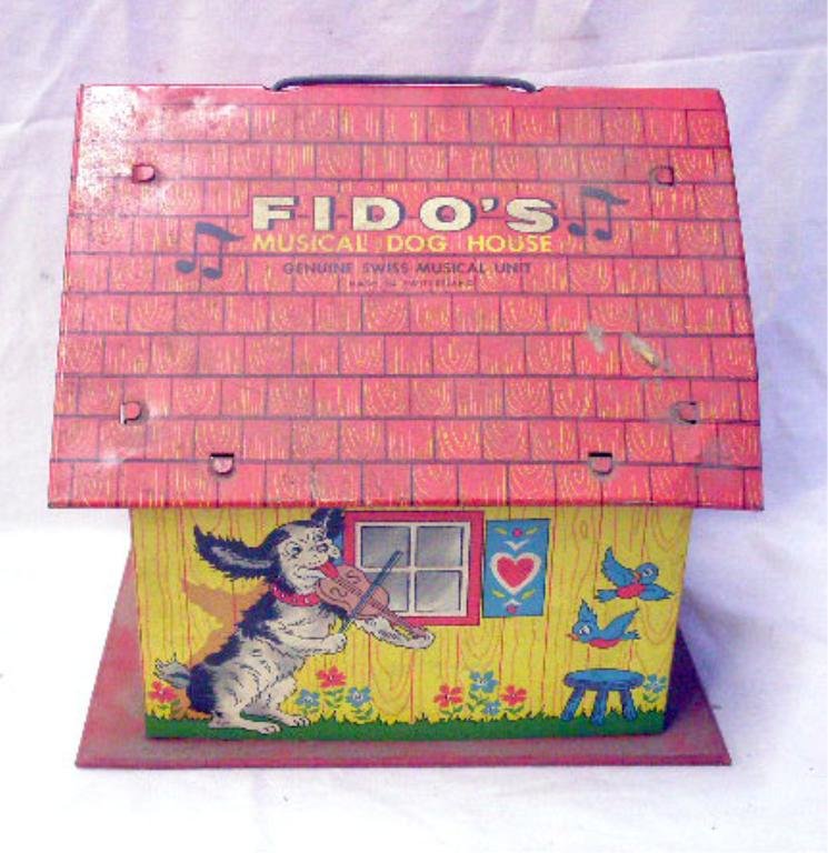 Ohio Art Fido's Musical Dog House: 1950's Ohio Art Co. lithographed tin Fido's Musical Dog House. CONDITION: Music works but Fido does not pop out, areas with wear & or loss.