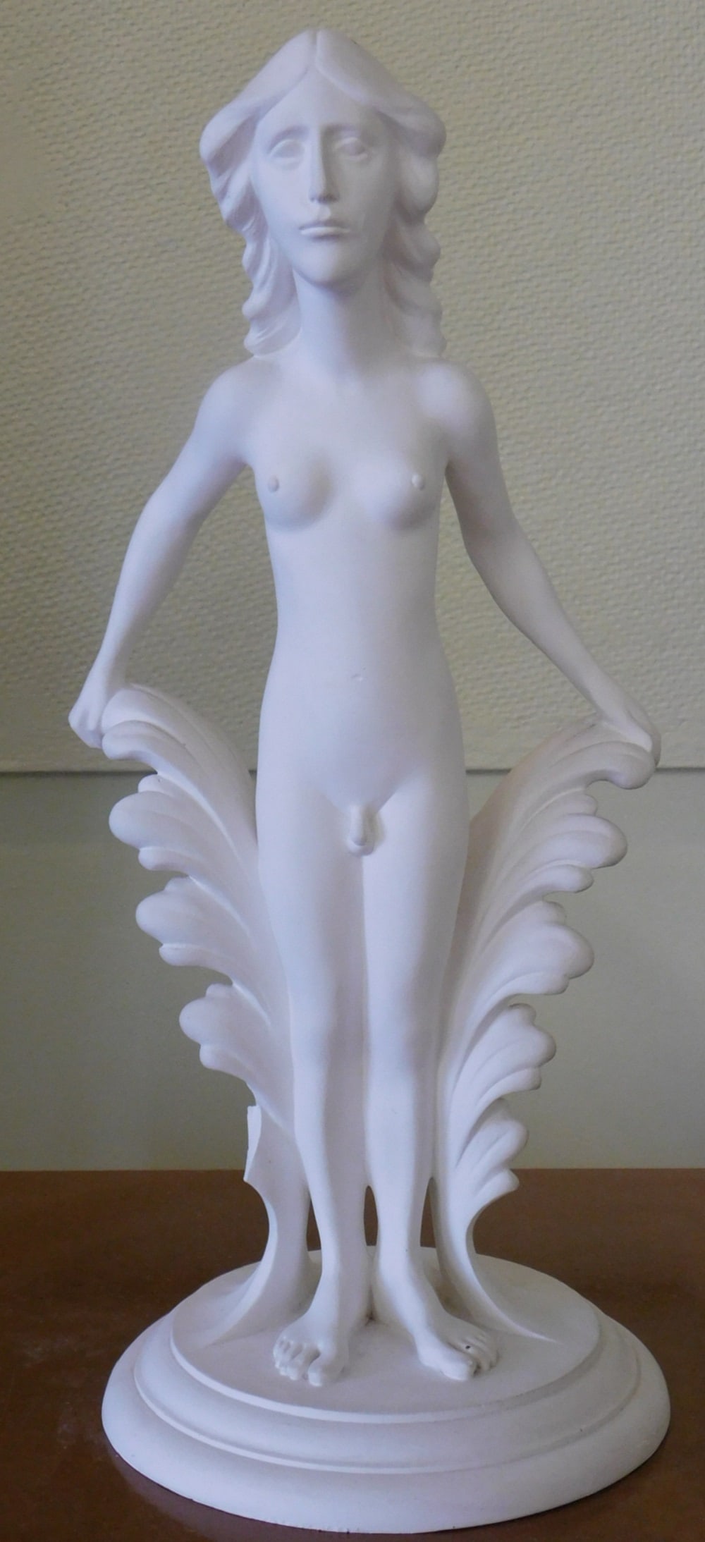 Stephen Robin Gypsum Sculpture: Stephen Robin (1944 - 2018) gypsum casting sculpture, "Hermaphrodite", standing nude between two acanthus leaves, 1986, 14 1/2" h. x 6" d., comes with Certificate of Authenticity. Condition: Excellent
