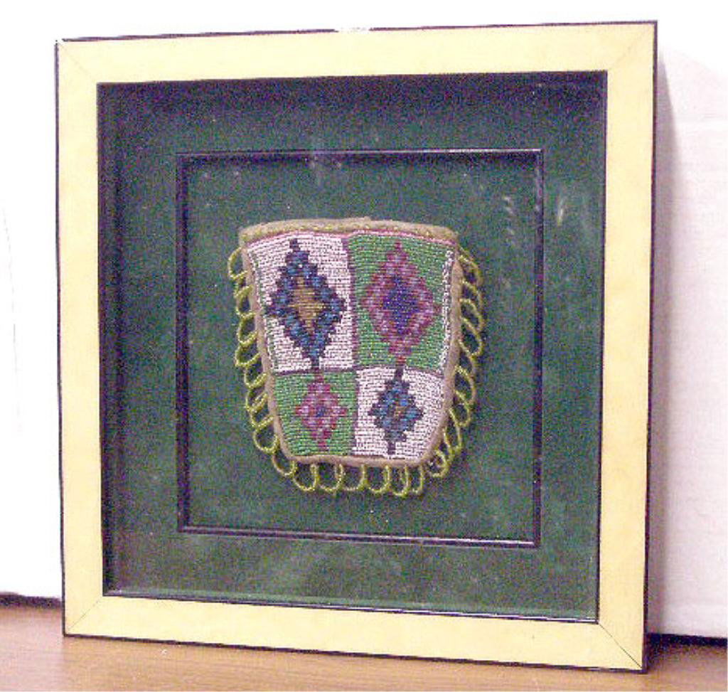 American Indian Beaded & Leather Pouch: Framed antique American Indian beaded & leather 4 1/4" x 4" pouch, mounted & set into a 9 1/2" x 9 1/4" frame. CONDITION: Very good with no damage, frame has small wood loss.