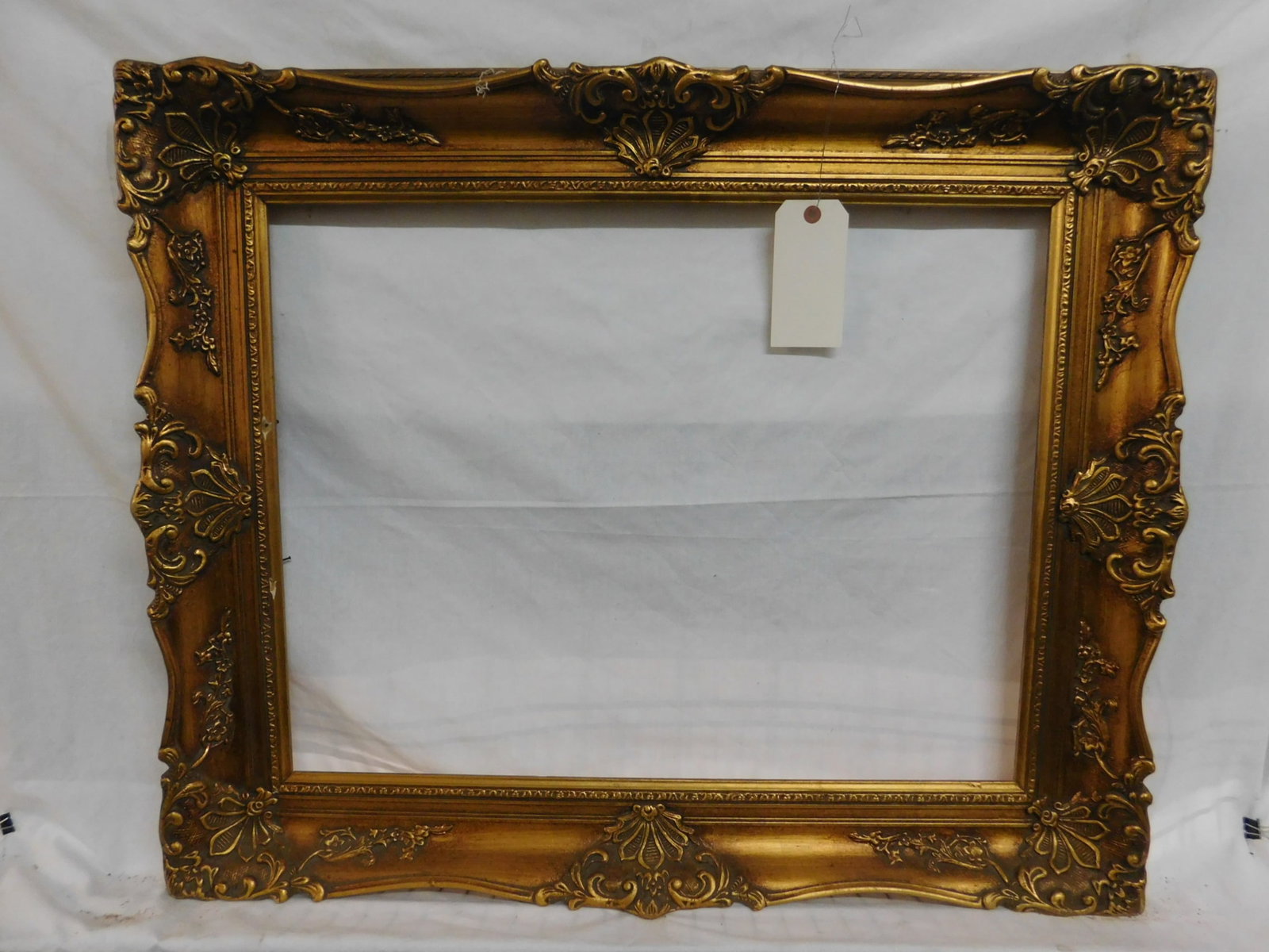 Baroque Frame: Baroque Frame, gilt frame, acanthus and floral sprig, molded over wood, 28" x 34 1/4", interior 20" x 26". CONDITION: Minor gilt wear on edges.