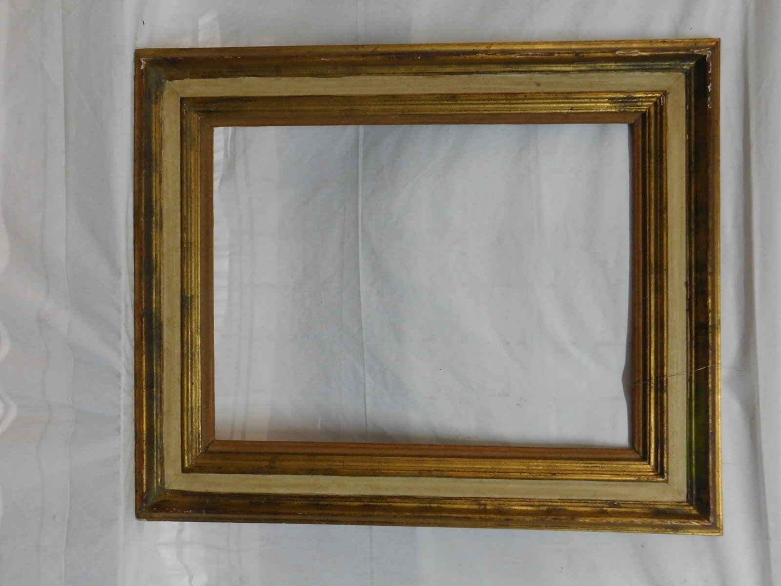 Antique Frame: Antique Frame, gilt, painted and gessoed over wood molded frame, 28 3/4" x 35"; interior 20 1/4" x 26 3/8". CONDITION: Areas of gilt wear and losses.