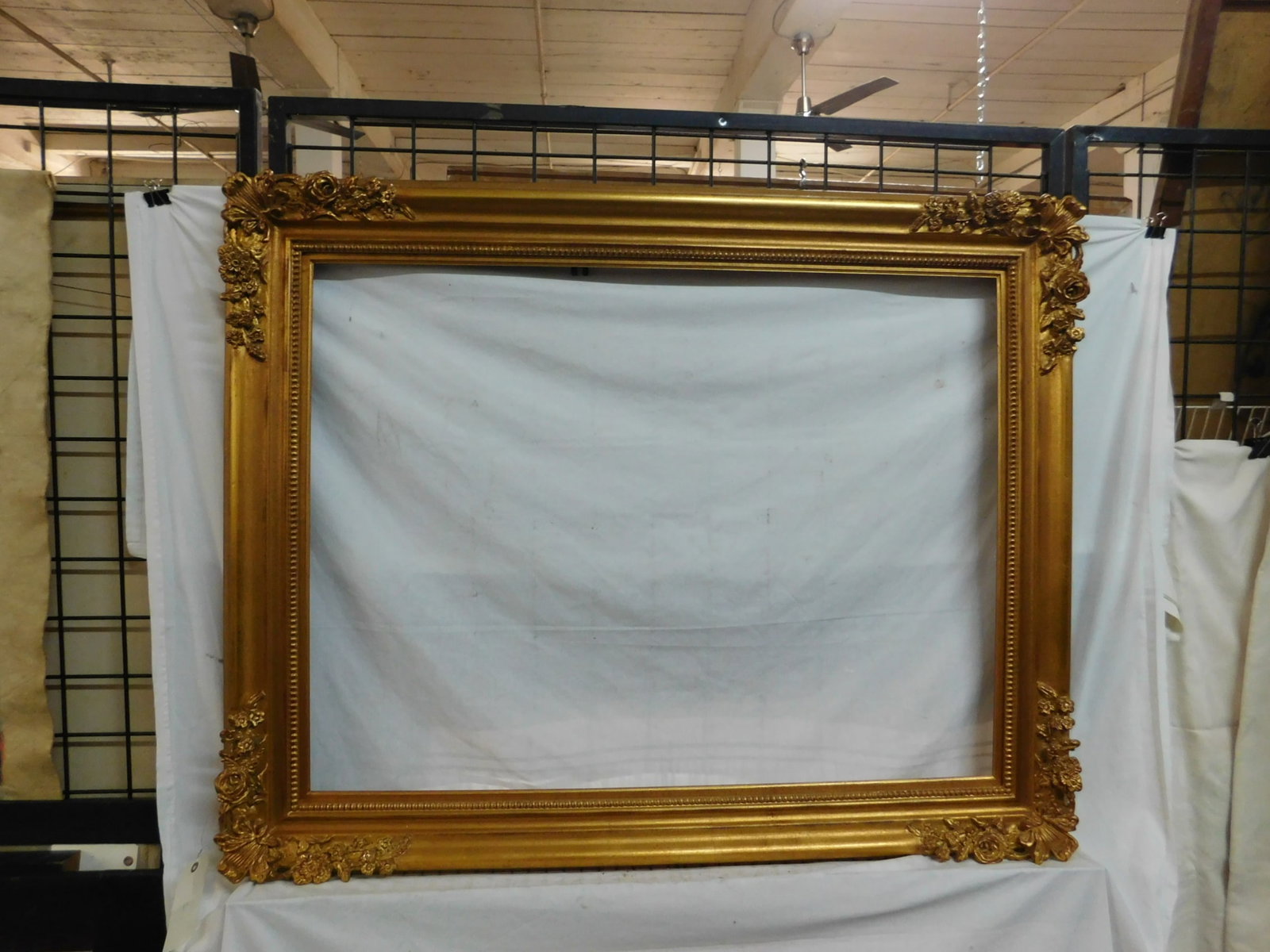 Large Baroque Frame: Large Baroque Frame, gilt over gesso with raised floral and acanthus molded corners; beaded inner border,39" x 50", interior 31 1/2" x 40 1/4". CONDITION: Very fine. No issues identified.