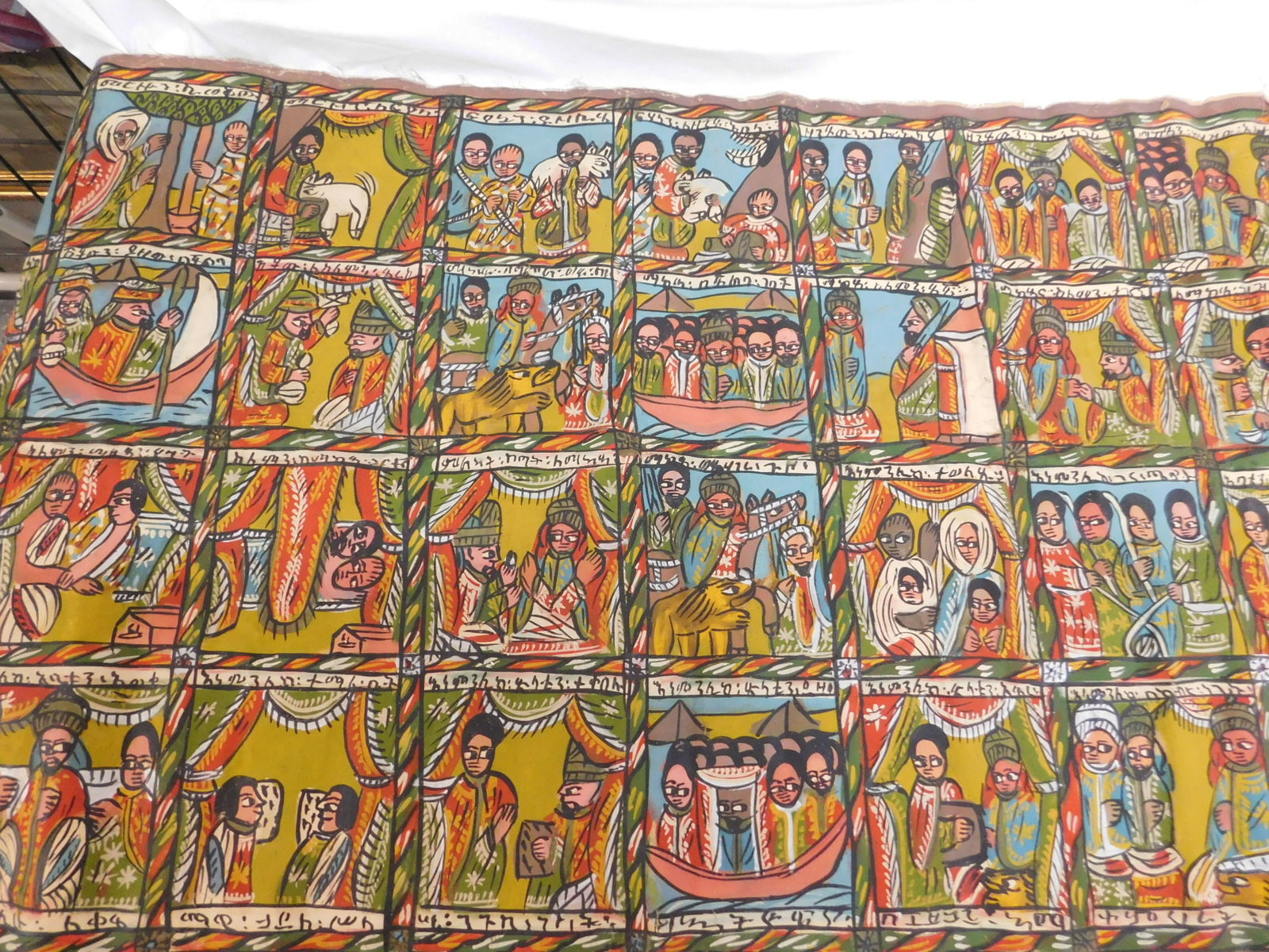 Ethiopian Story Painting: Ethiopian Story Painting, colorful, oil on canvas, forty-four panels, depict the story of King Solomon and Queen Sheba and the bringing of the Ark of the Covenant to Ethiopia, each with text, unframed