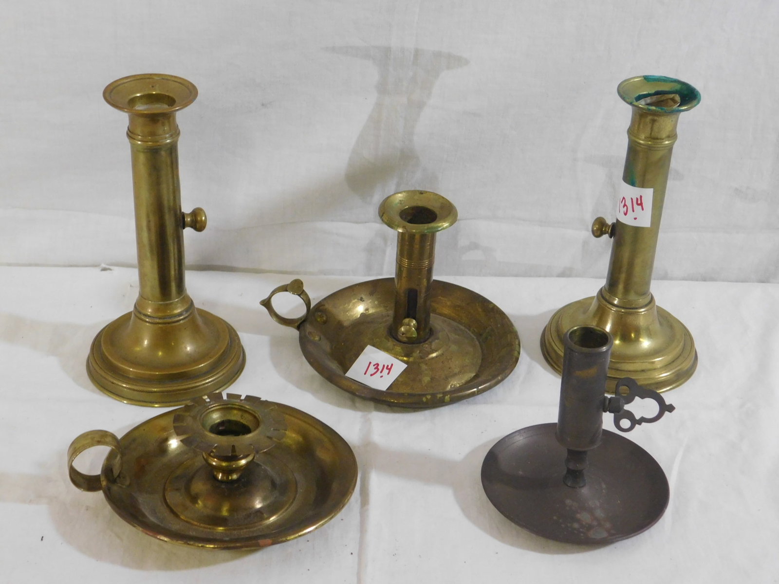 5 Brass Candle Sticks: 5 Brass candle sticks, (2) 7 1/2" push up and 3 finger lamps, 19th / 20th c. Condition: tarnish, some candle wax residue