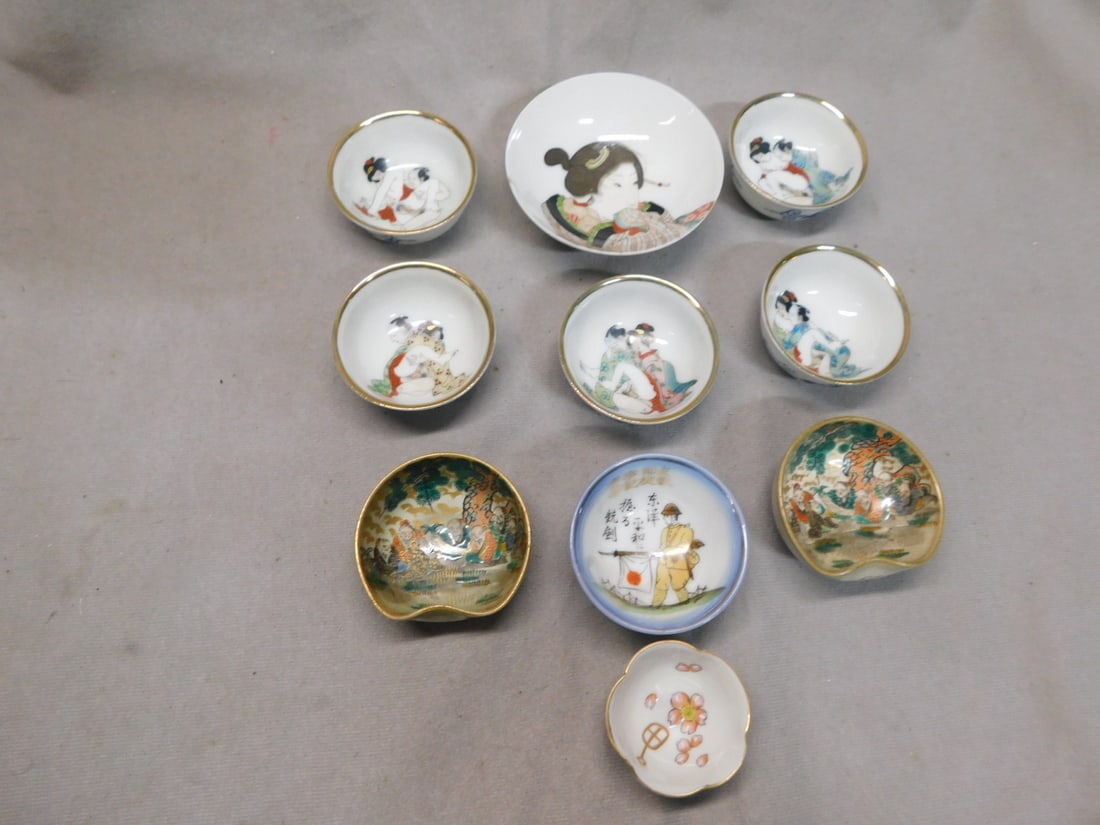 10 Oriental Erotic & Other Cups: Ten Oriental Erotic and Other Cups, porcelain, Includes: seven painted erotic, two pinched side with Noblemen and one WW II vintage with soldier,from 1 3/4"d to 3 1/4'd. CONDITION: Very fine,large cup