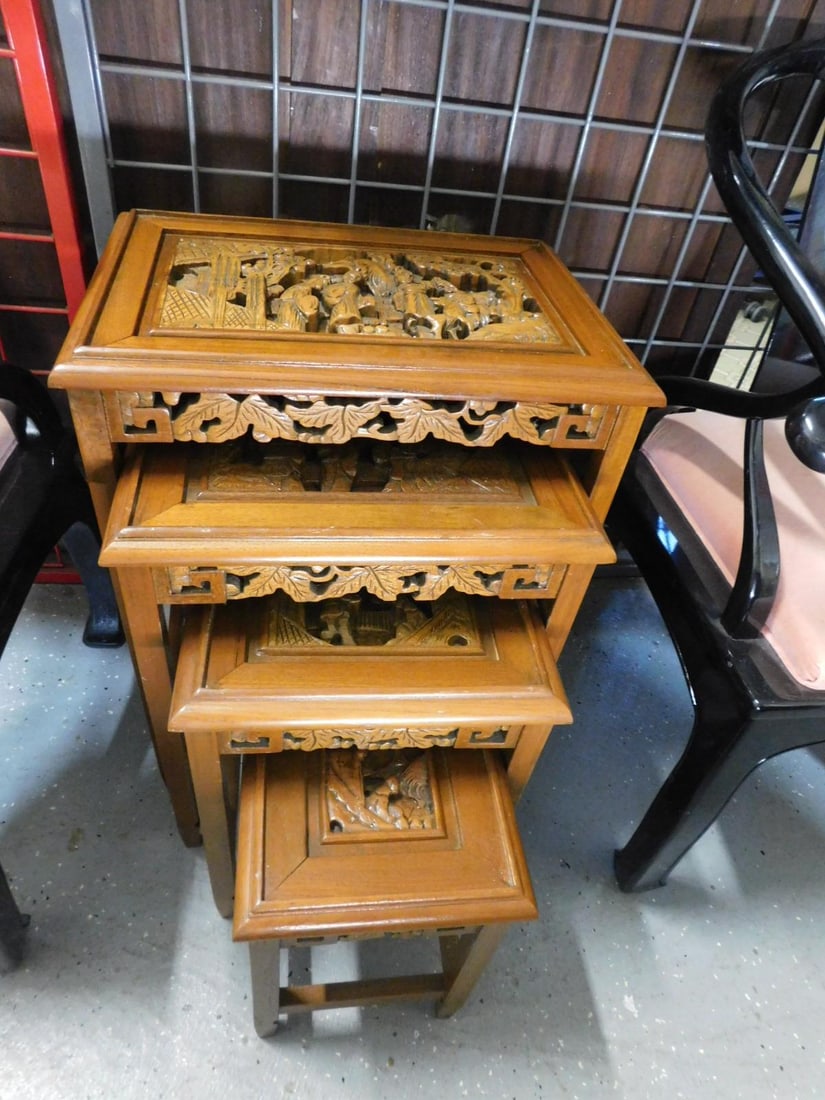 Chinese Nest of Tables: Chinese Nest of Tables, high relief carved hardwood, nest of four tables each with figural life scene tops and foliate carved aprons, mid 20th C, largest, 20" x 14" x 25". CONDITION: Very fine. No pro