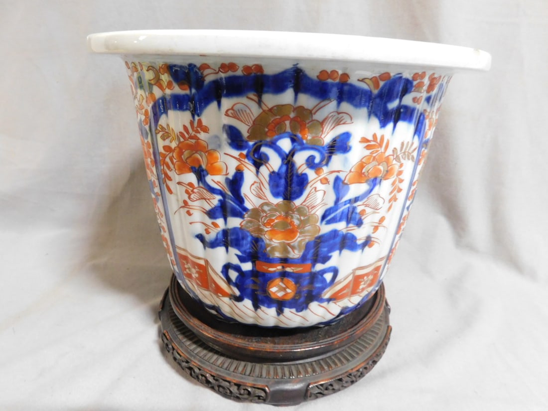 Imari Porcelain Jardineer: Imari Porcelain Jardineer, Japanese rib molded body with typical Imari bold colors and gold work, depicting panels of floral urns in floral fields, 19th C, 1"d, 7 1/2"h, includes: finely carved and re