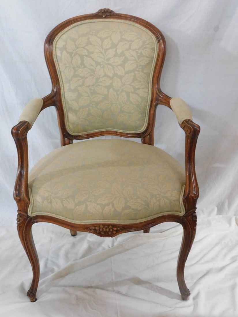 Louis XV Style Fauteuil: Louis XV Style Fauteuil, Fruitwood frame with rose carved crest and cabriole legs, pale green and beige foliate cloth upholstery, mid 20th C, 38 1/2"h. CONDITION: Very fine.