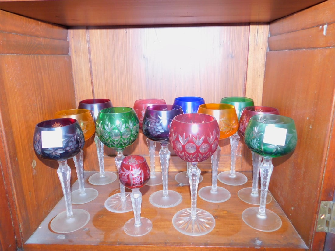 (13) Multi colored lead crystal wine goblets: (13) Multi colored lead crystal wine goblets, 8" with cut crystal stems plus cordial. Condition: good, need cleaning