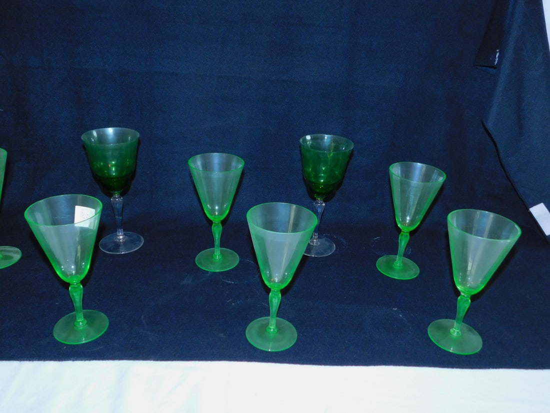 (9) green crystal goblets: (9) green crystal goblets including: (7) 7" and (2) 8" with crystal stems. Condition: very good
