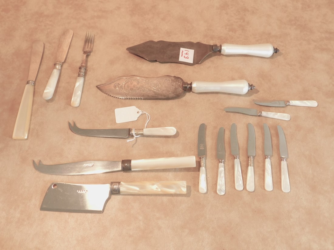 M of P handled flatware: Mother of Pearl handled flatware including: (8) 4 1/2" butter knives, 6" butter spreader with engraved blade, 7" cheese knife, 6" fork with engraved blade, (3) Sabre (France) faux M of P specialty kni