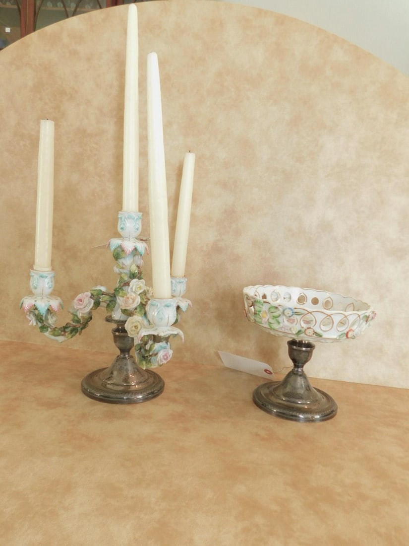 (2) sterling candle sticks: (2) sterling candle sticks, weighted, gadrooned boarders, 4" h. embellished with hand painted and applied floral and reticulated 7" dia. removable bowl and other 4 candle holder floral embellished rem