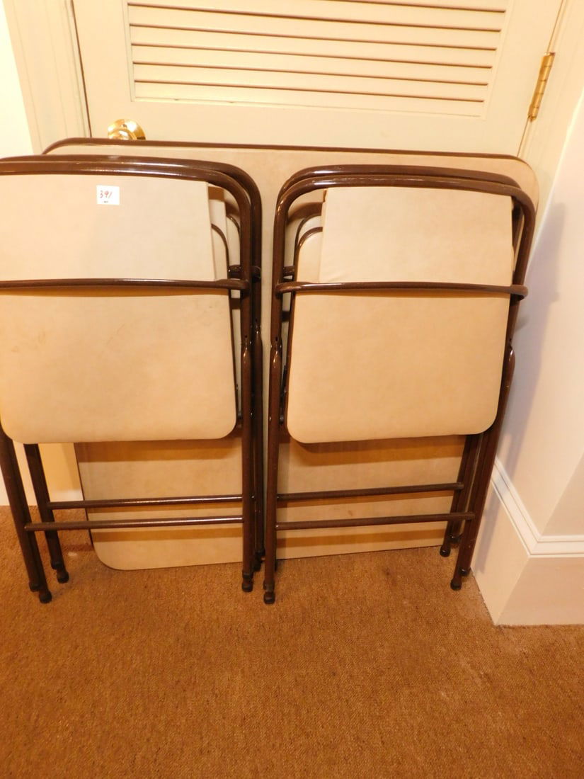 Card table and 4 chairs: Card table and 4 chairs, round tubular metal construction with cream vinyl seats and back, Condition: good, used, table is wobbly