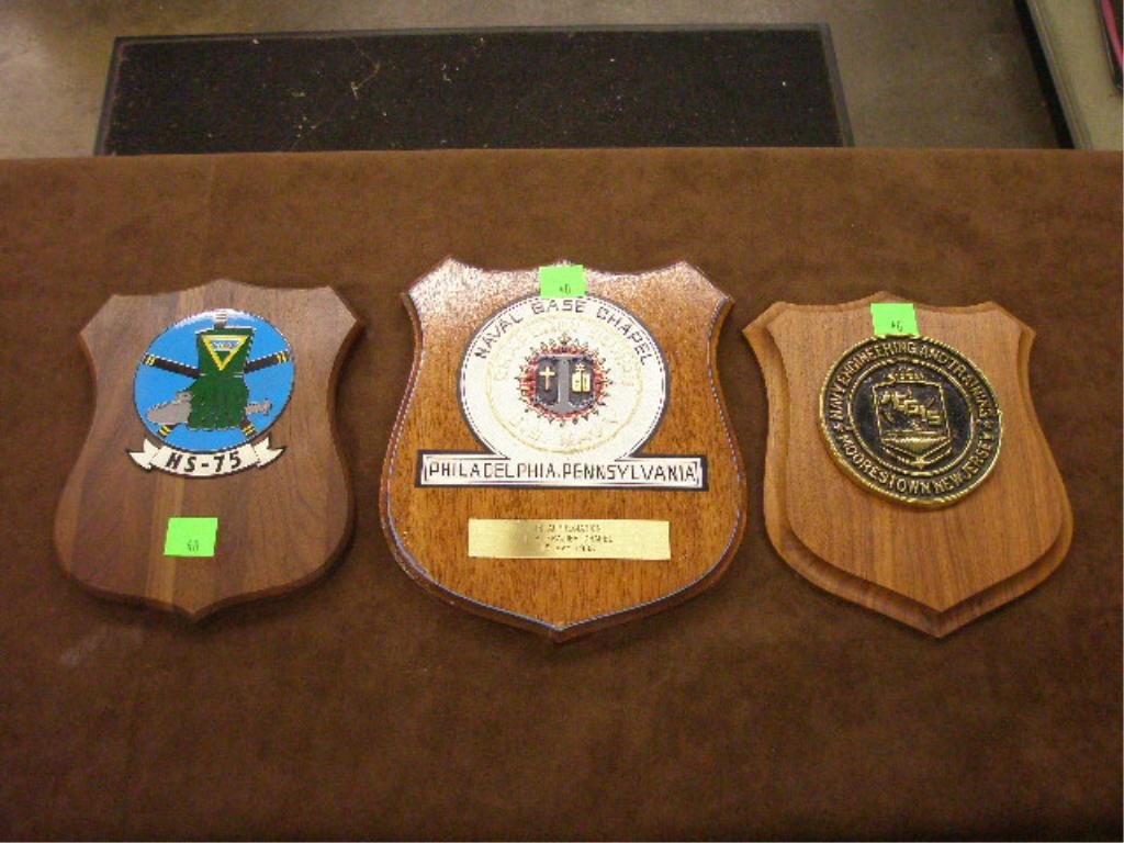 Lot of 3 Naval Presentation Plaques: Lot of 3 Naval presentation plaques; Naval Base Chapel, HS-75, Navy Engineering and Training. Wood backings with brass, plastic, and composition crests. Provenance: Non-accessioned property from the I