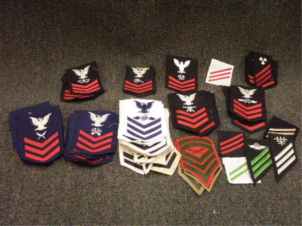 Tray Lot of US Navy Uniform Arm Patches: Tray lot of US Navy uniform arm patches; Petty Officer 1st & 2nd class, seaman, machinist mate, torpedo man, soundman, radioman, fire control man, and others. Provenance: Non-accessioned property from